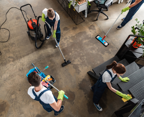 Top View Of Cleaning Company Team Cleaning Modern Office
