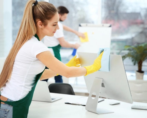 Worker Cleaning Office Computer