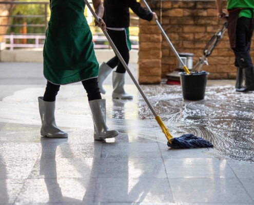Workers Mopping New Building
