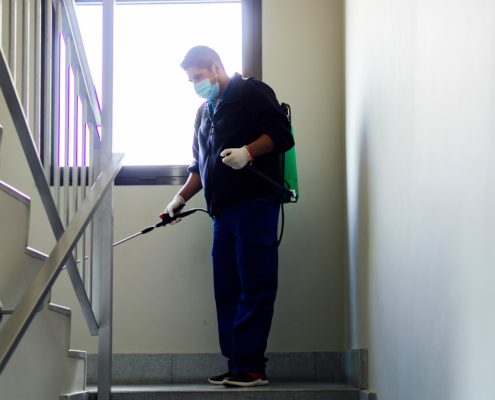 Maintenance Personnel Disinfecting To Prevent The Spread Of Covid19